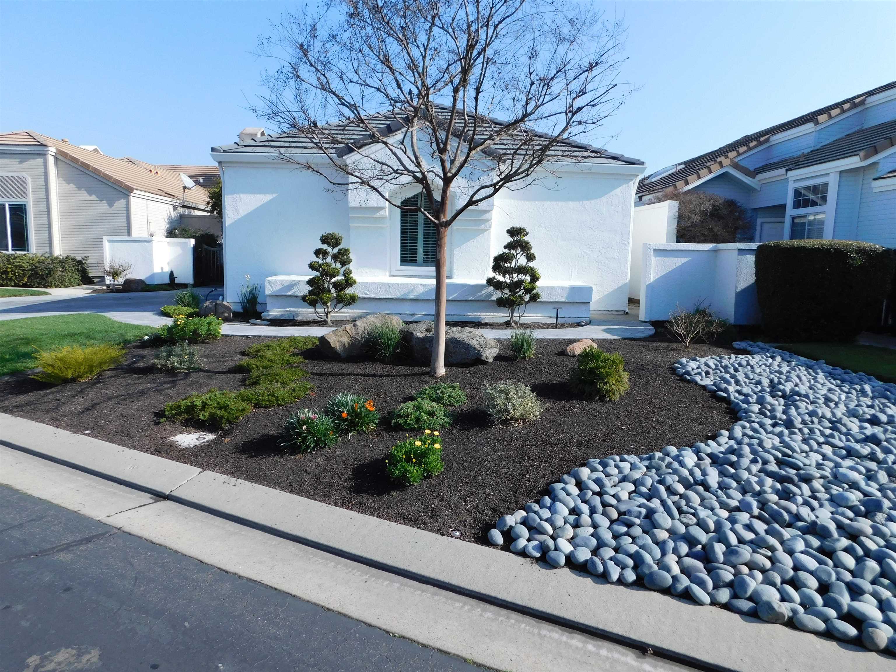 1169 Copper Cottage Lane Modesto, CA 95355 - Photo 2 of 42 a front view of a house with garden
