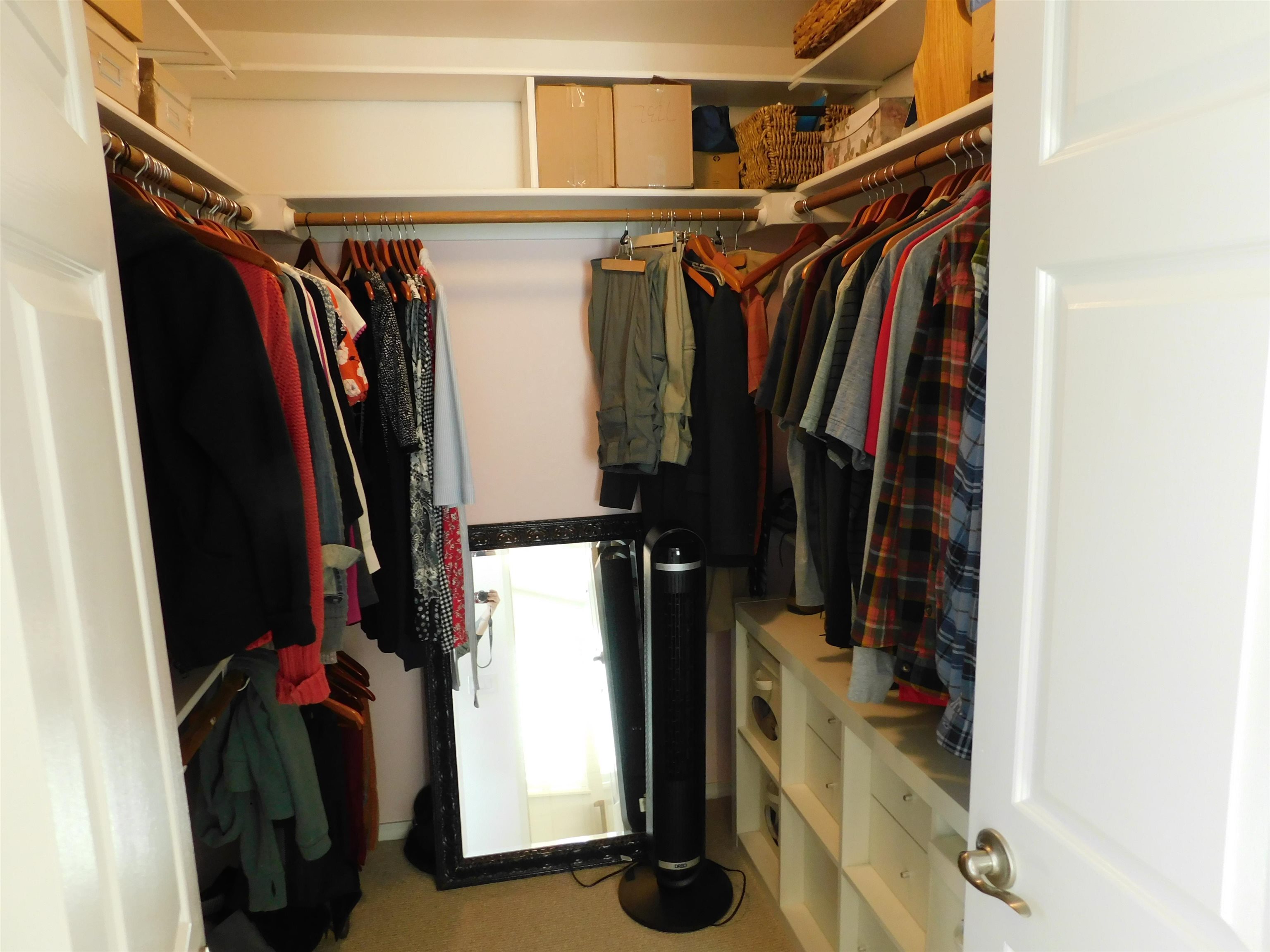 1169 Copper Cottage Lane Modesto, CA 95355 - Photo 24 of 42 a view of walk in closet with clothes and shoes