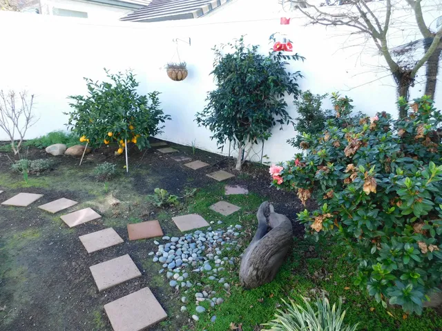 a front view of a house with sitting area