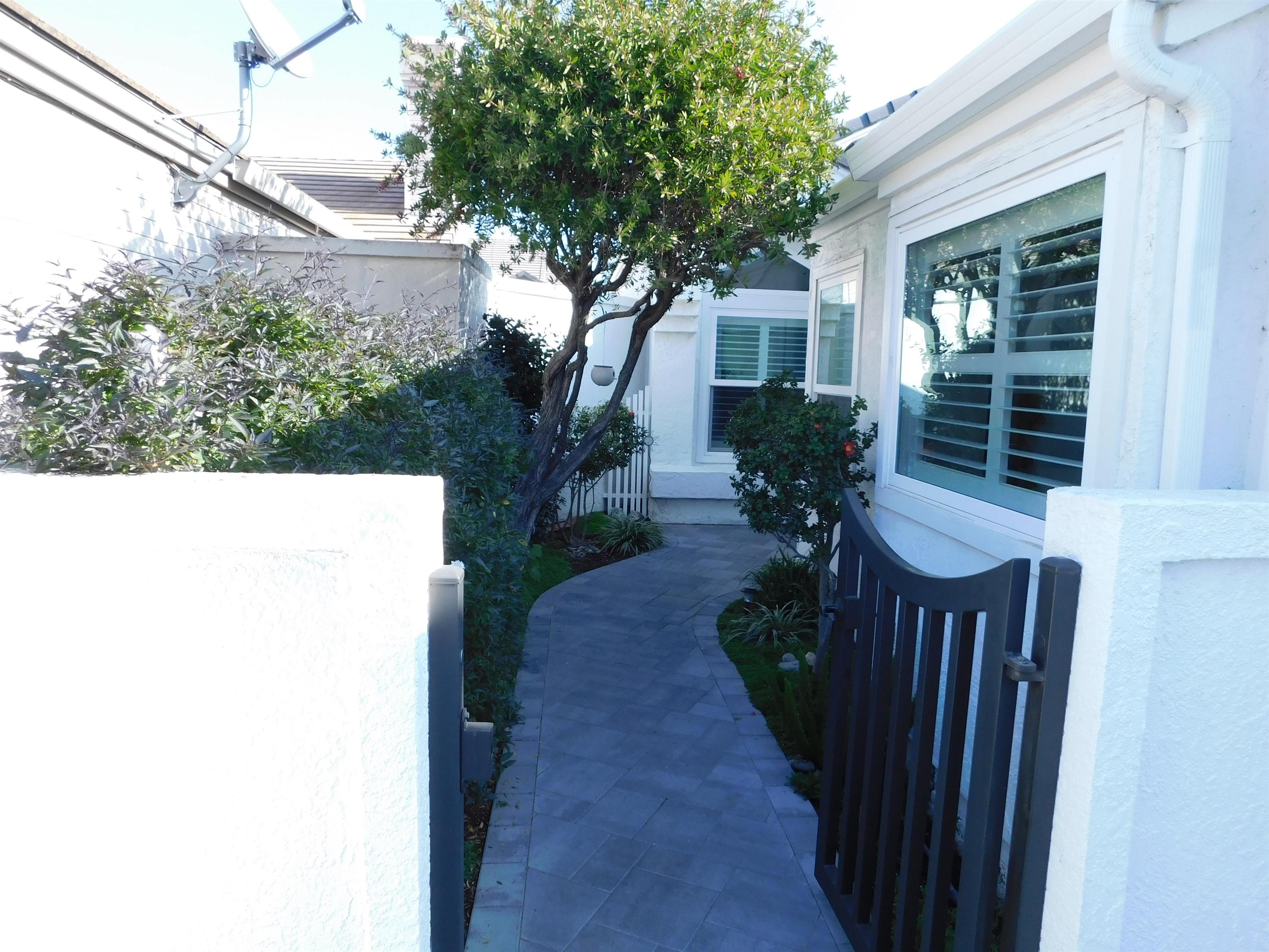 1169 Copper Cottage Lane Modesto, CA 95355 - Photo 3 of 42 a view of a house with a yard