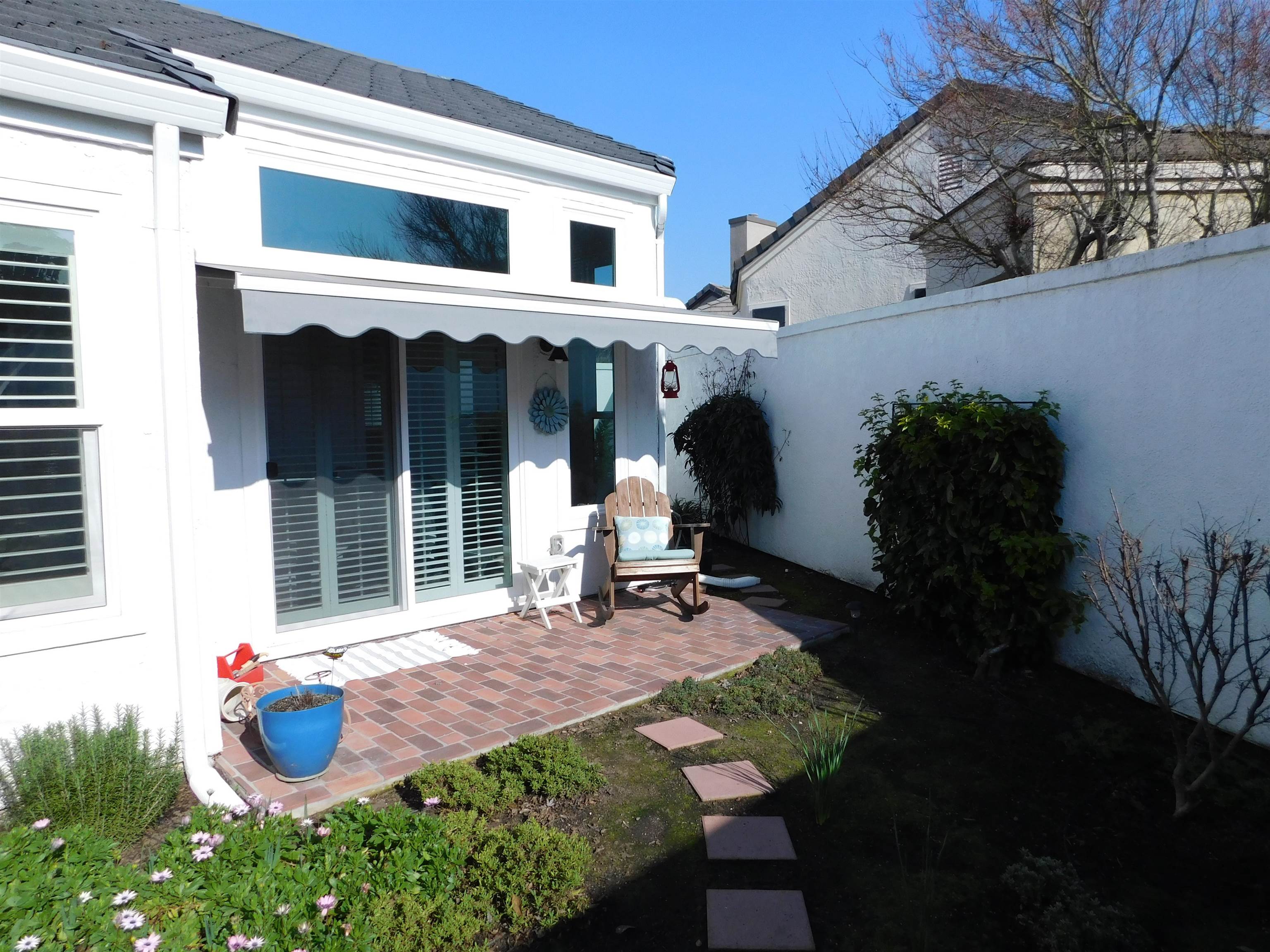 1169 Copper Cottage Lane Modesto, CA 95355 - Photo 31 of 42 a front view of a house with sitting area