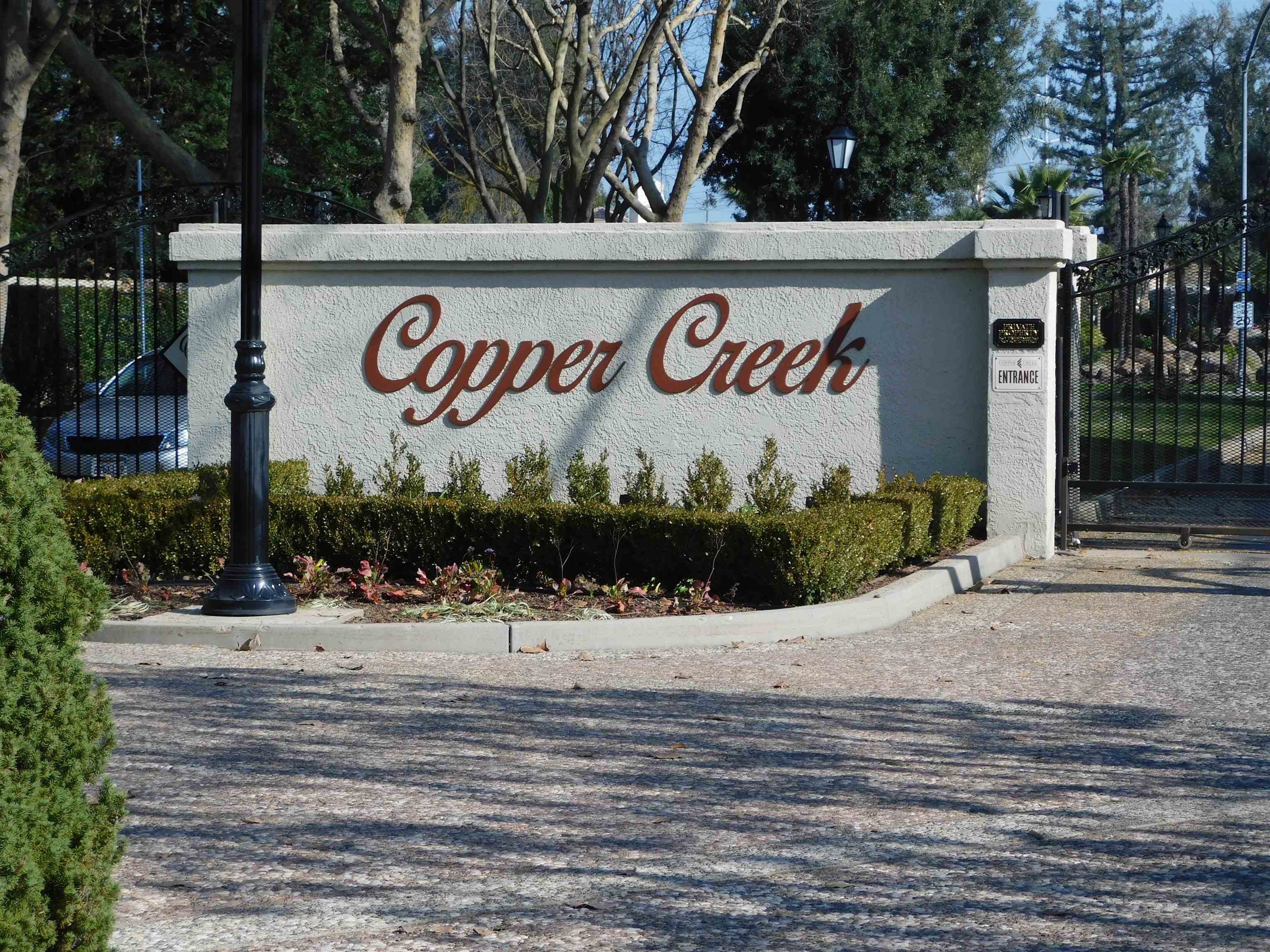 1169 Copper Cottage Lane Modesto, CA 95355 - Photo 35 of 42 a sign board on the side of a building