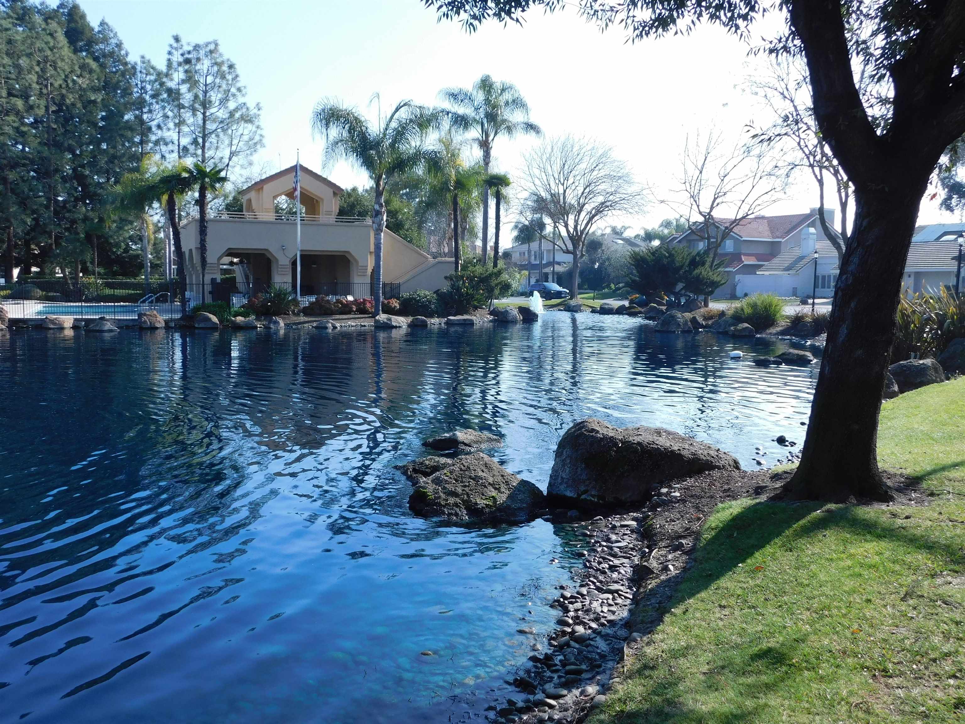 1169 Copper Cottage Lane Modesto, CA 95355 - Photo 38 of 42 a view of a lake with houses