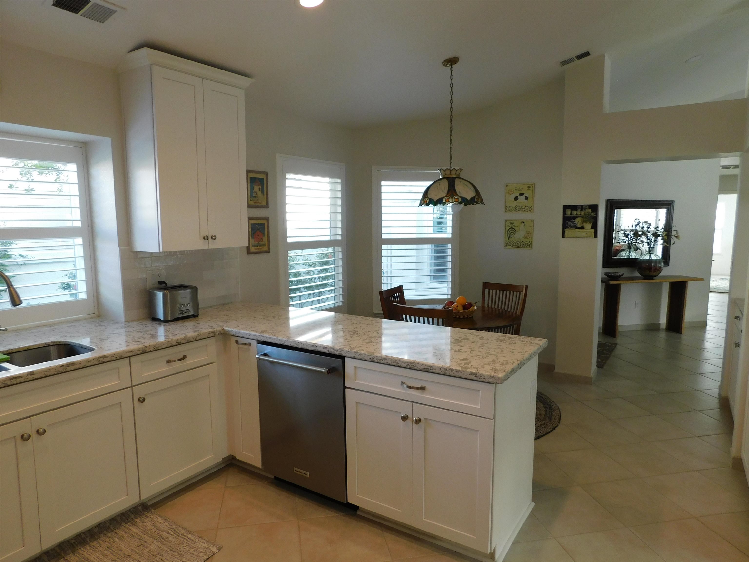 1169 Copper Cottage Lane Modesto, CA 95355 - Photo 10 of 42 a kitchen with a sink stove and cabinets