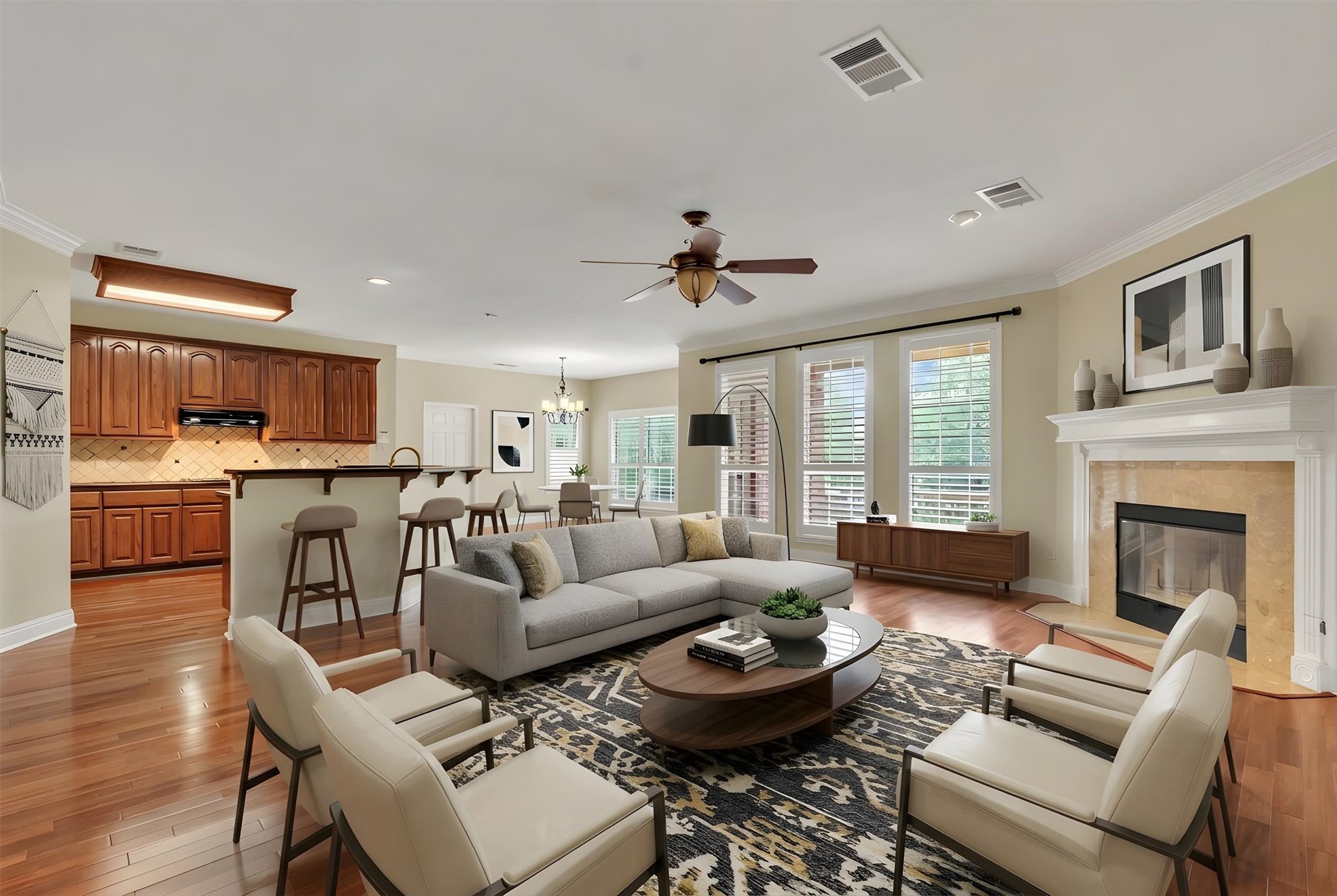 6008 Tributary Ridge Court Austin, TX 78759 - Photo 6 of 36 Virtually staged open living space features hardwood flooring and a classic fireplace.