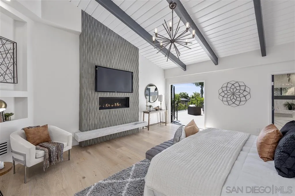 5780 Rutgers Road La Jolla, CA 92037 - Photo 14 of 25 a bedroom with a bed and a chair