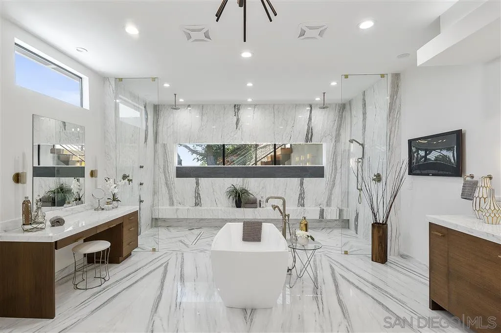 5780 Rutgers Road La Jolla, CA 92037 - Photo 16 of 25 a living room with stainless steel appliances furniture a flat screen tv and a view of kitchen