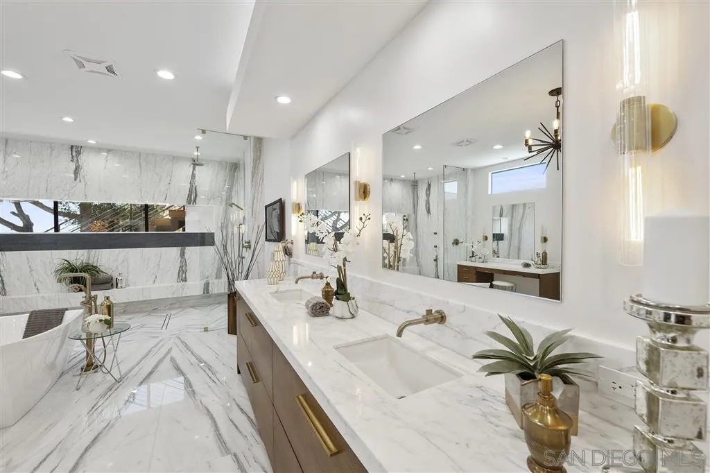 5780 Rutgers Road La Jolla, CA 92037 - Photo 17 of 25 a large kitchen with kitchen island a large counter top a sink stainless steel appliances and cabinets