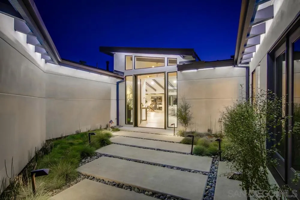 5780 Rutgers Road La Jolla, CA 92037 - Photo 2 of 25 a view of a house with a small yard