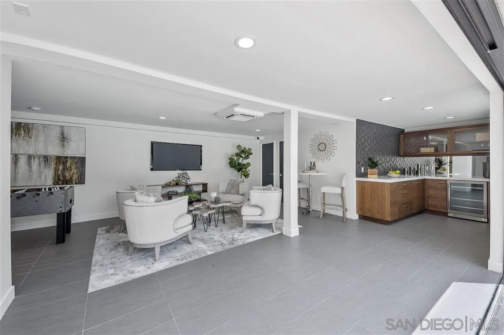 5780 Rutgers Road La Jolla, CA 92037 - Photo 22 of 25 a living room with furniture a view of a living room and kitchen view
