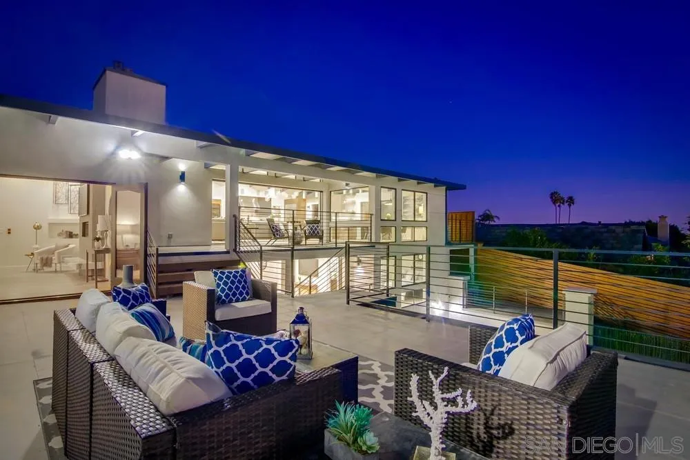 5780 Rutgers Road La Jolla, CA 92037 - Photo 6 of 25 a living room with furniture and a floor to ceiling window