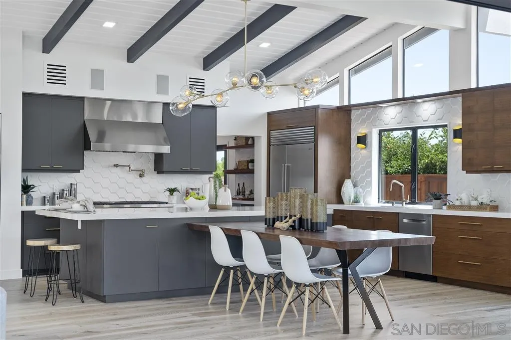 5780 Rutgers Road La Jolla, CA 92037 - Photo 10 of 25 a large kitchen with a table and chairs in it