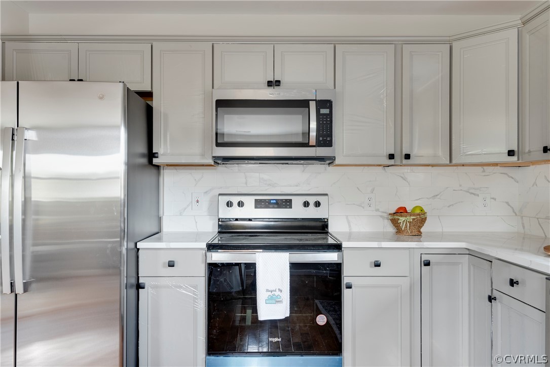 1114 Covington Road Colonial Heights, VA 23834 - Photo 11 of 47 a kitchen with a refrigerator stove and microwave