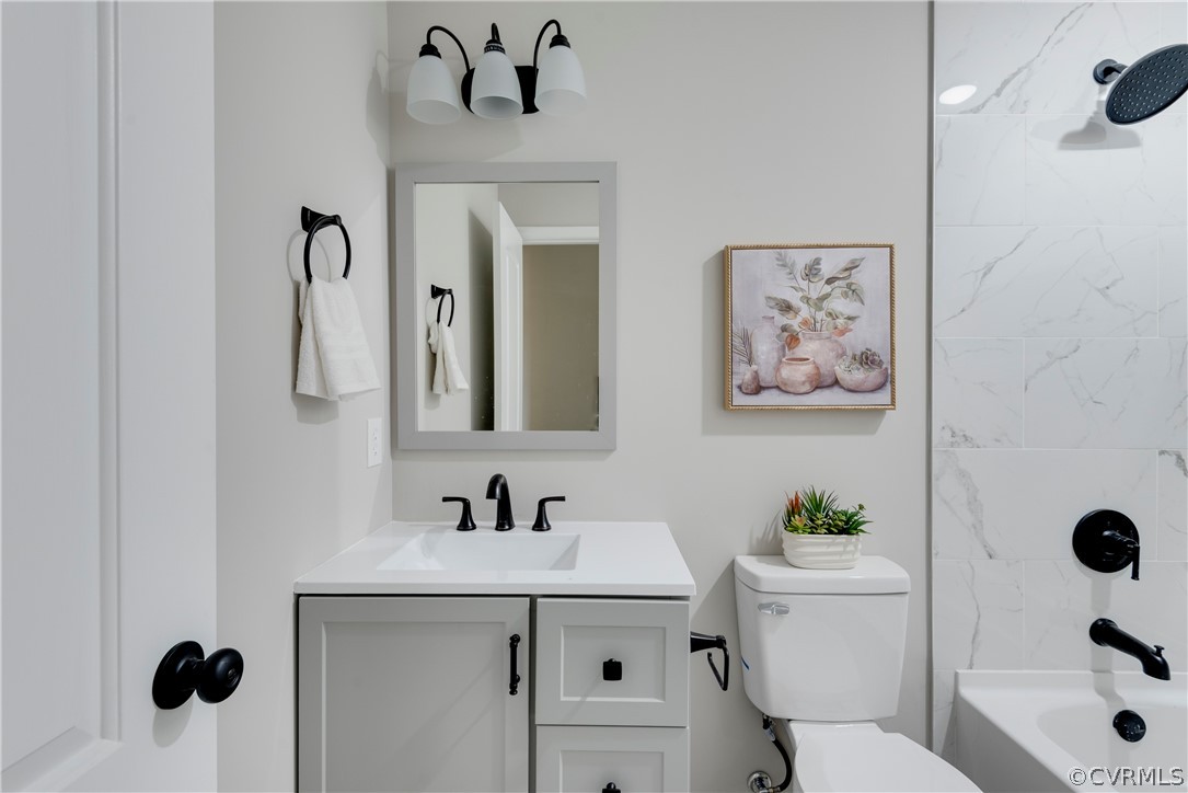 1114 Covington Road Colonial Heights, VA 23834 - Photo 17 of 47 a bathroom with a sink toilet and shower