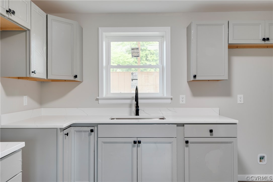 1114 Covington Road Colonial Heights, VA 23834 - Photo 29 of 47 a kitchen with white cabinets and window