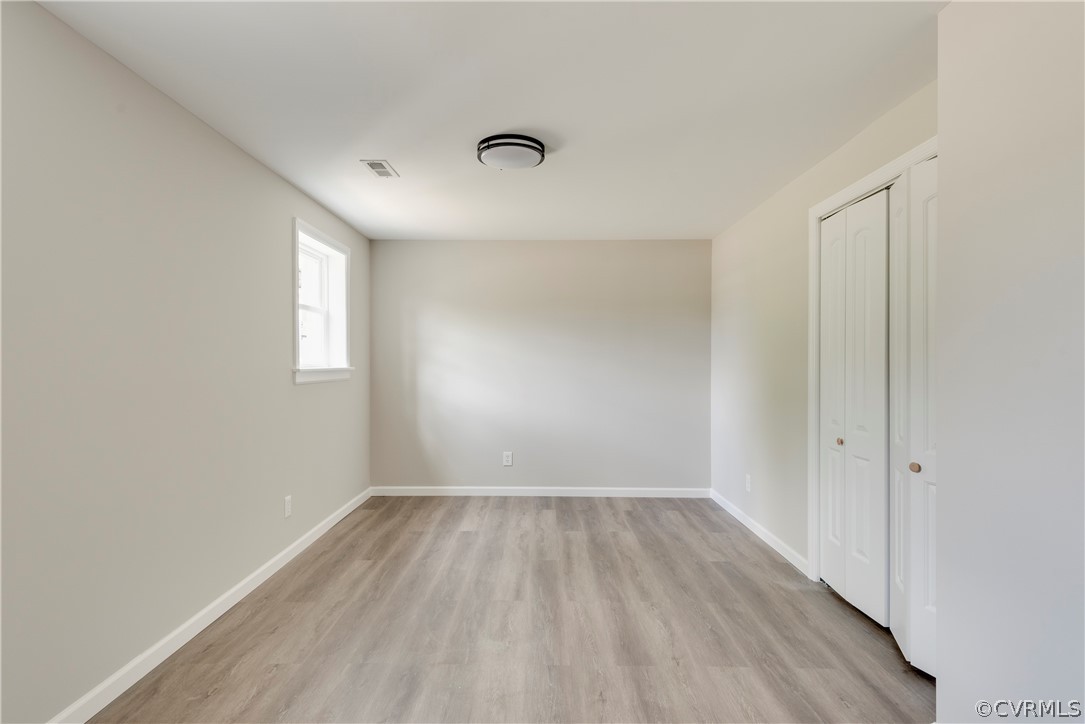 1114 Covington Road Colonial Heights, VA 23834 - Photo 39 of 47 wooden floor in an empty room with a window