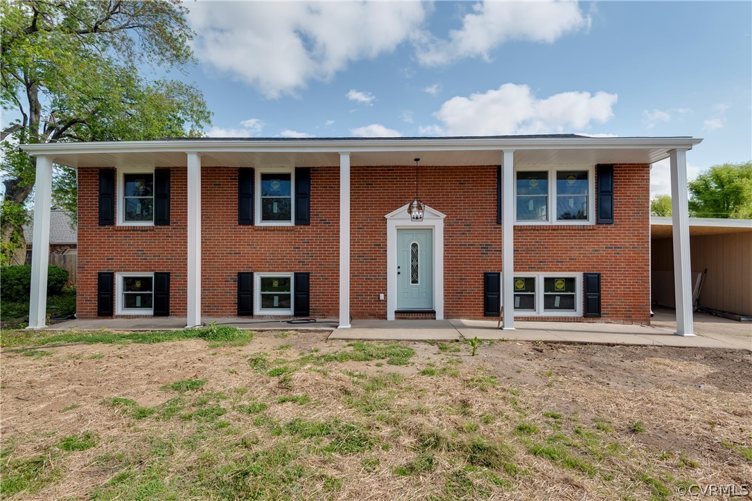 1114 Covington Road Colonial Heights, VA 23834 - Photo 5 of 47 a front view of a house with a garden