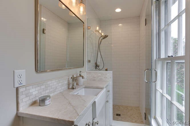 2706 Berkeley Pointe Drive Henrico, VA 23233 - Photo 30 of 48 a bathroom with a sink vanity granite and shower