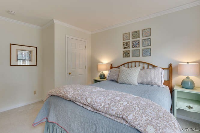 2706 Berkeley Pointe Drive Henrico, VA 23233 - Photo 32 of 48 a bedroom with a large bed and a table in it