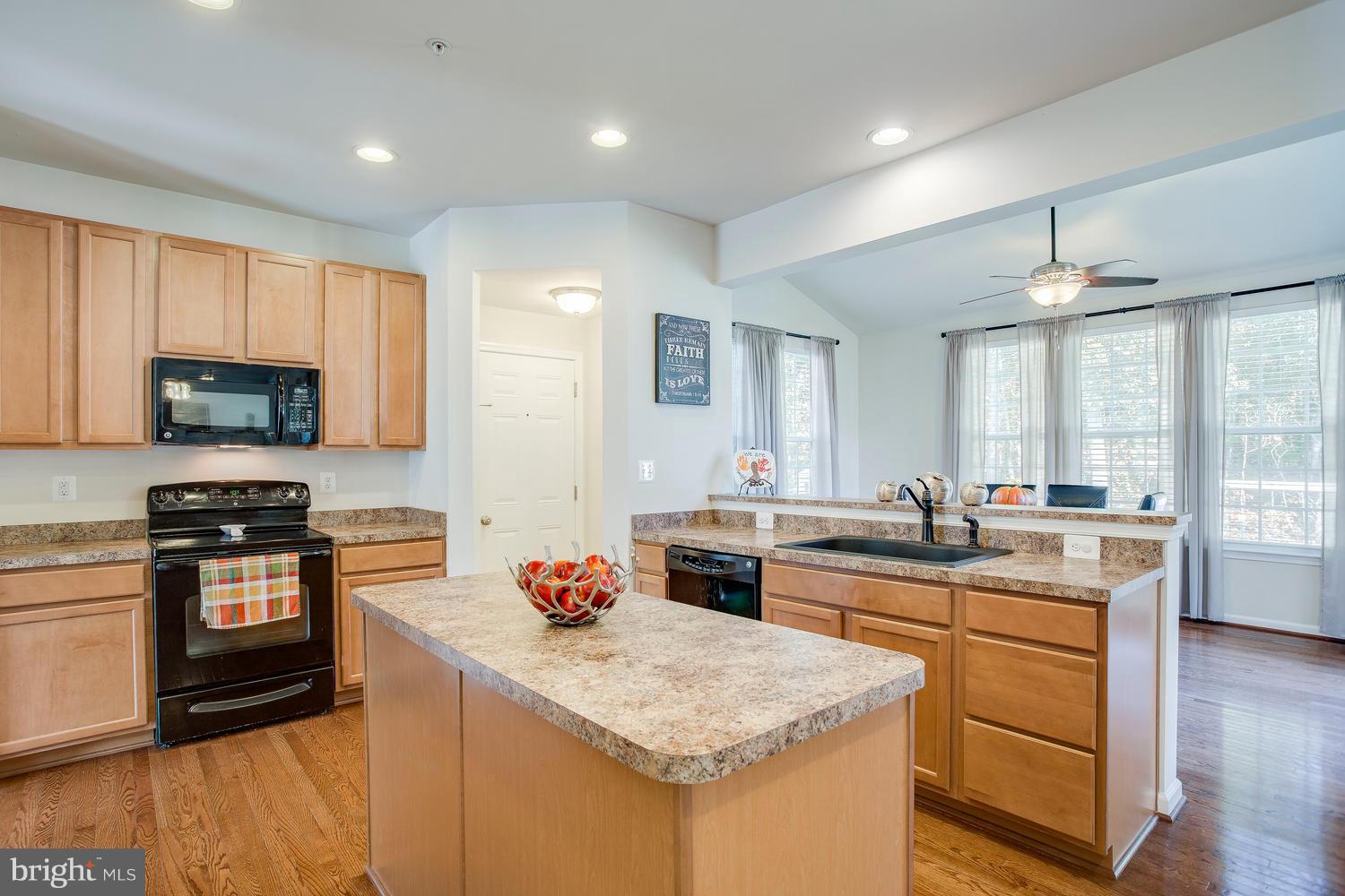913 Gladway Road Baltimore, MD 21220 - Photo 14 of 30 a kitchen with stainless steel appliances granite countertop a sink stove and refrigerator