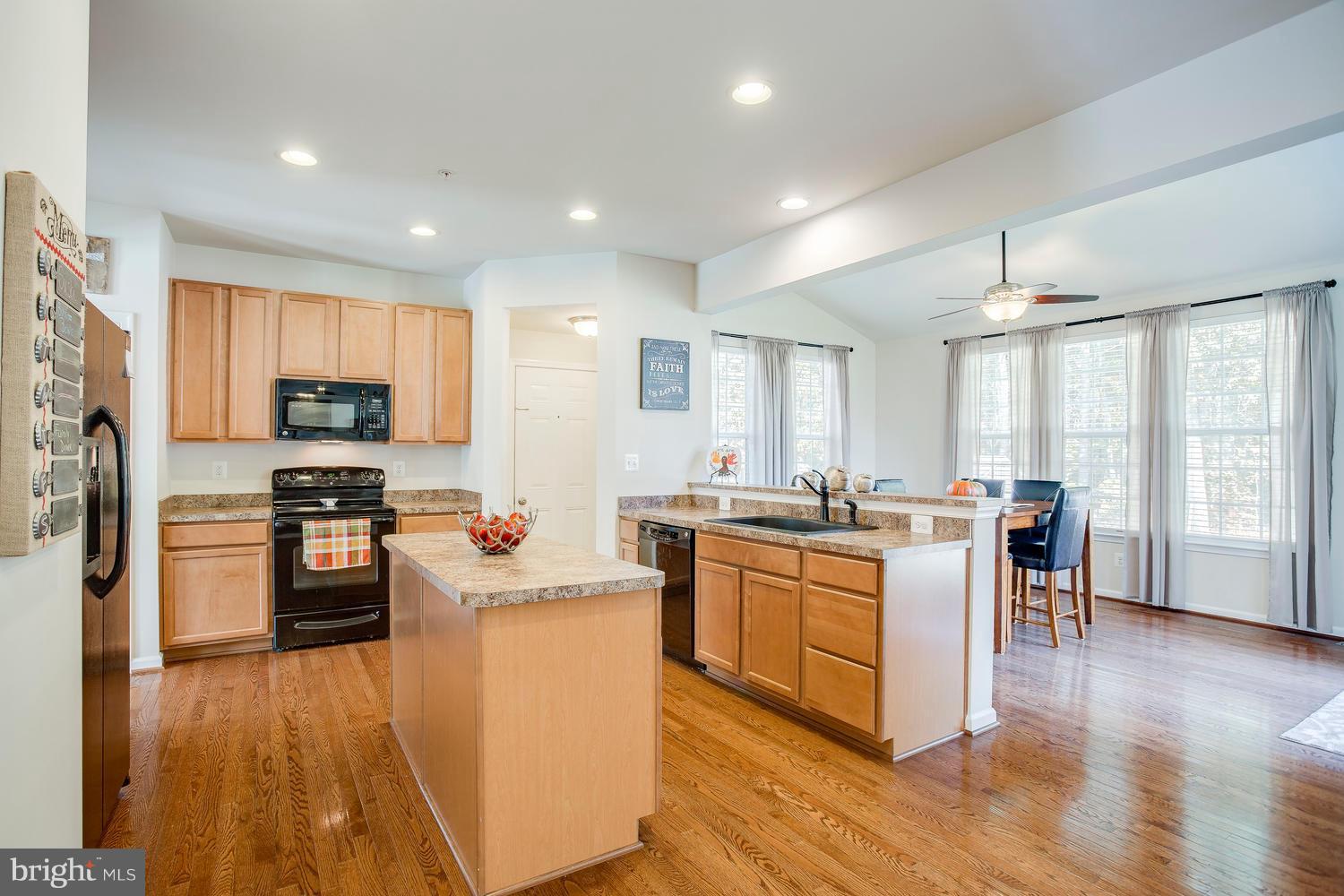 913 Gladway Road Baltimore, MD 21220 - Photo 3 of 30 a kitchen with a sink stove and refrigerator