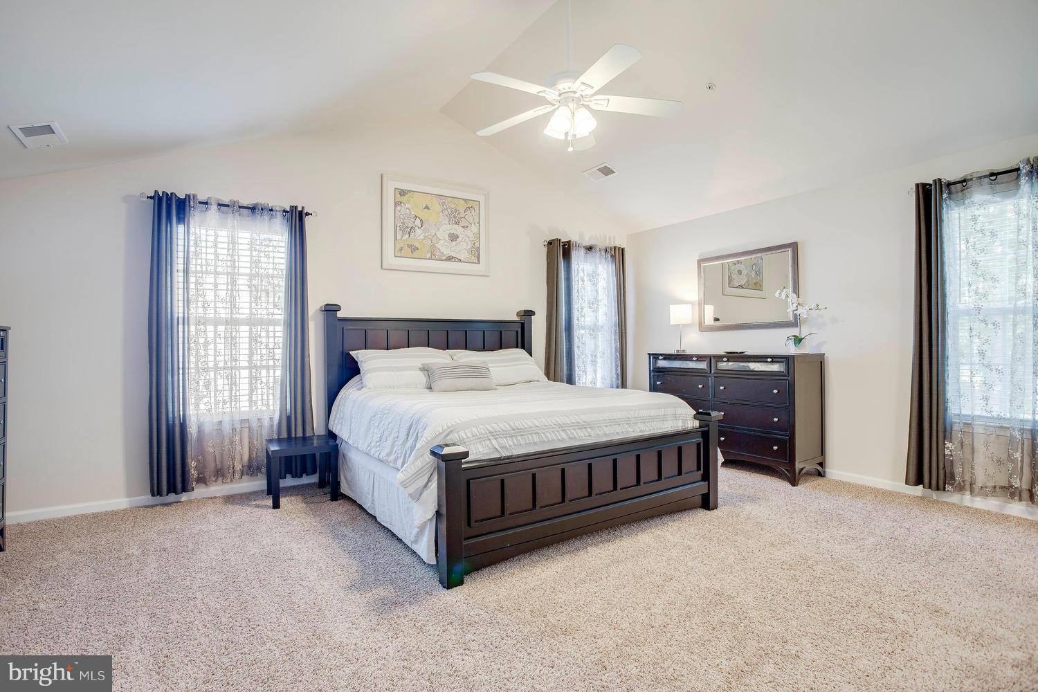 913 Gladway Road Baltimore, MD 21220 - Photo 5 of 30 a spacious bedroom with a bed a window and dresser
