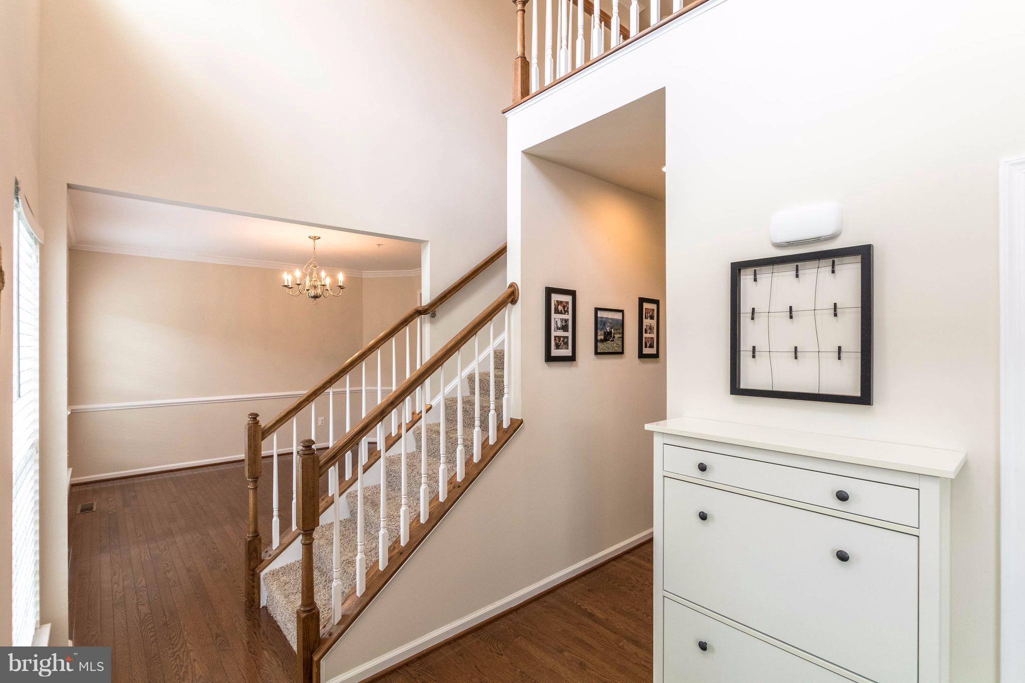 913 Gladway Road Baltimore, MD 21220 - Photo 6 of 30 a view of hallway with window and wooden floor
