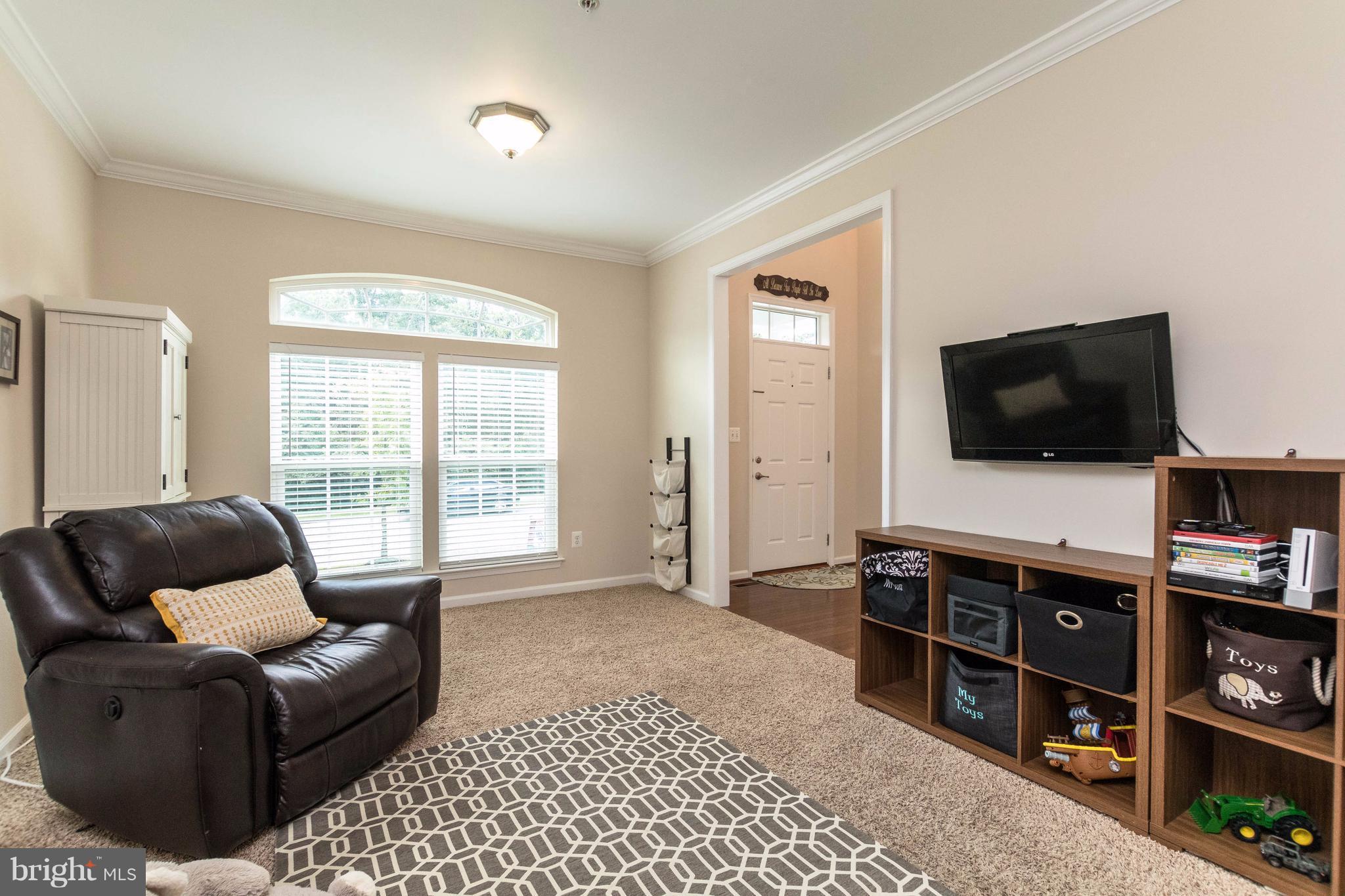 913 Gladway Road Baltimore, MD 21220 - Photo 7 of 30 a living room with furniture and a flat screen tv
