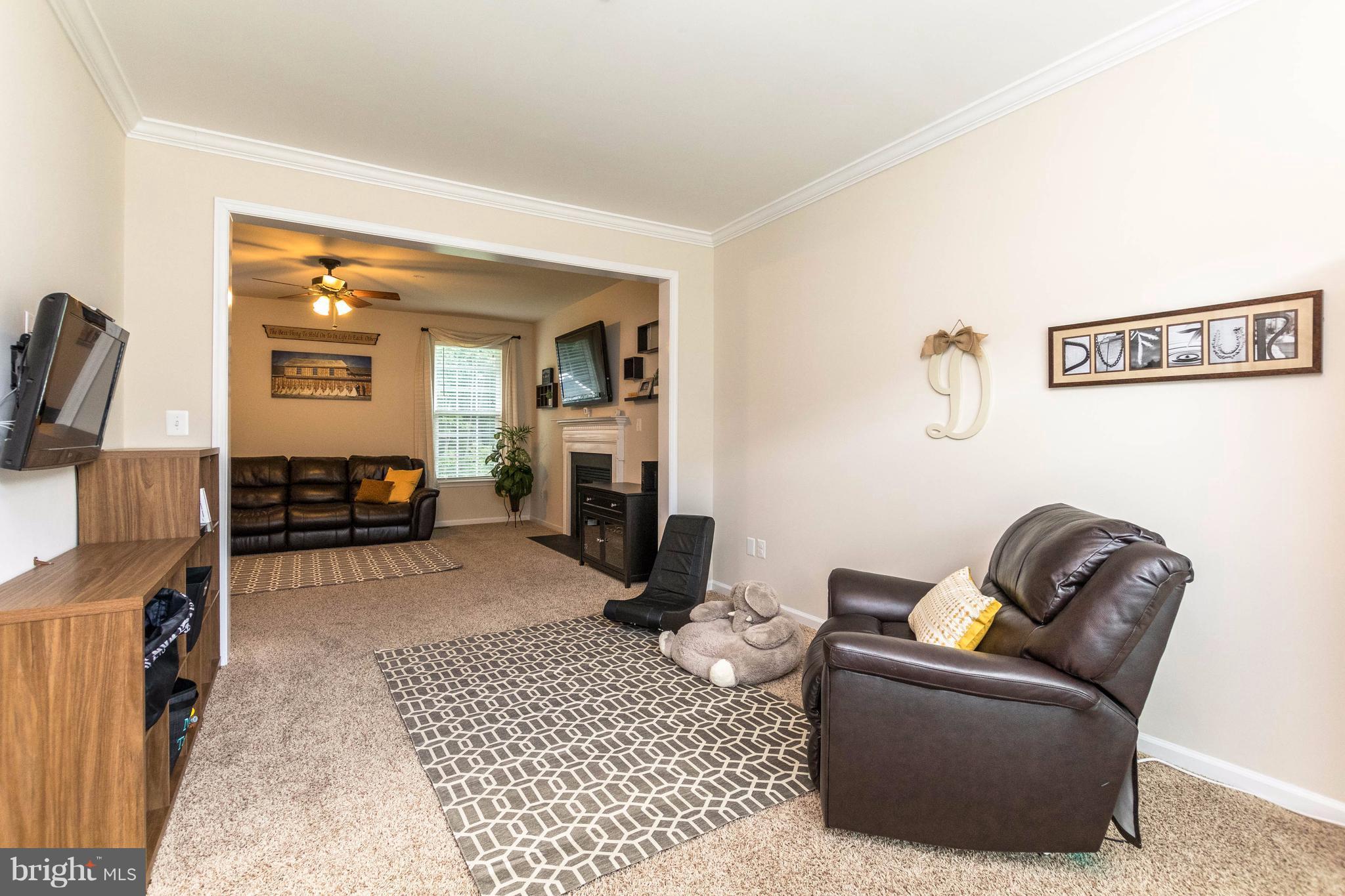 913 Gladway Road Baltimore, MD 21220 - Photo 8 of 30 a living room with furniture and a flat screen tv