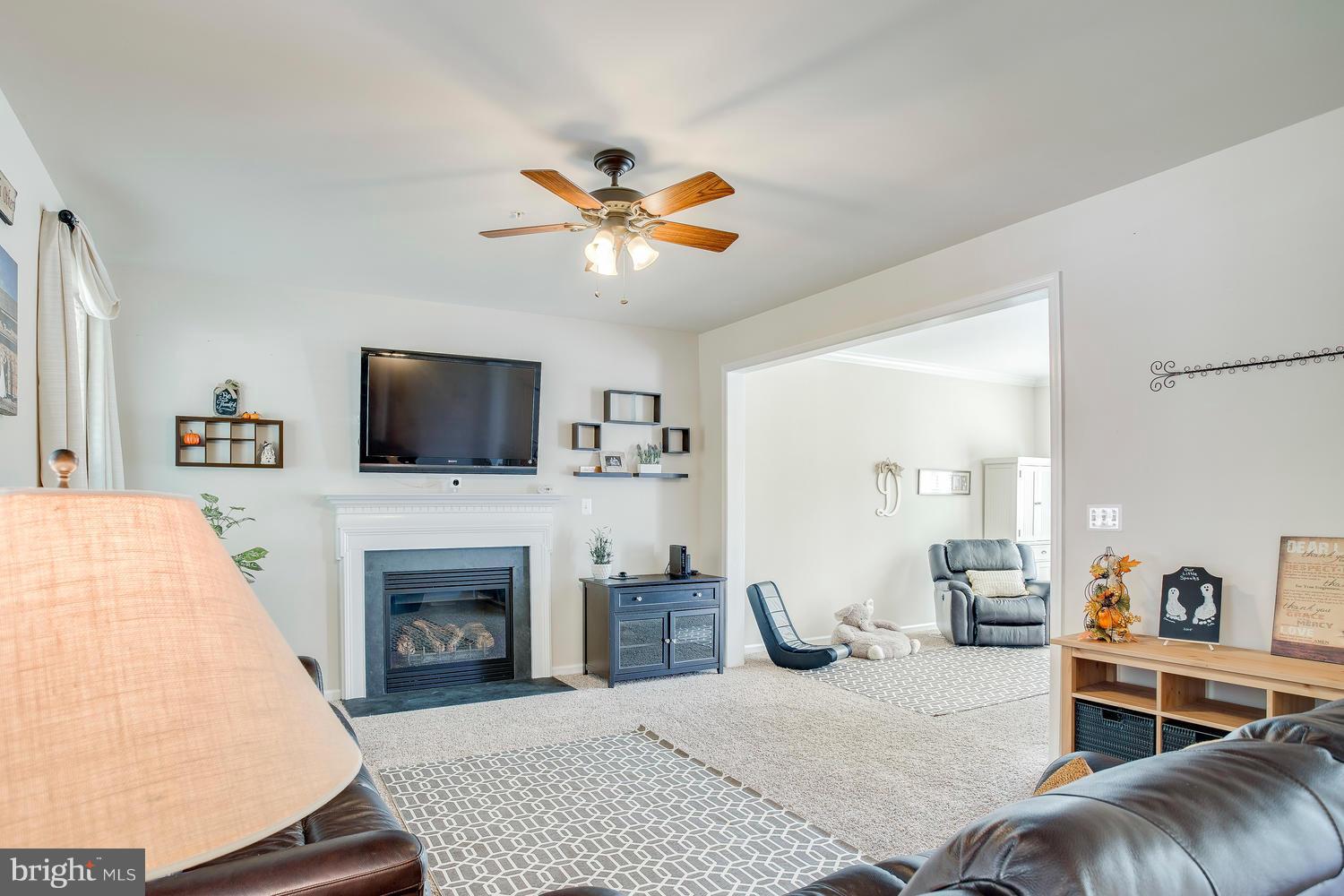 913 Gladway Road Baltimore, MD 21220 - Photo 10 of 30 a living room with furniture fireplace and flat screen tv