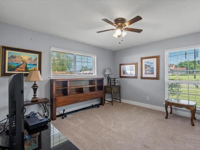 a bedroom with furniture and a window