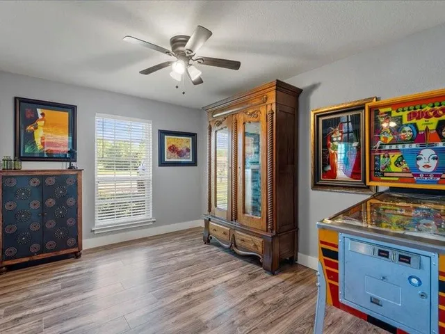 a view of an entryway with wooden floor