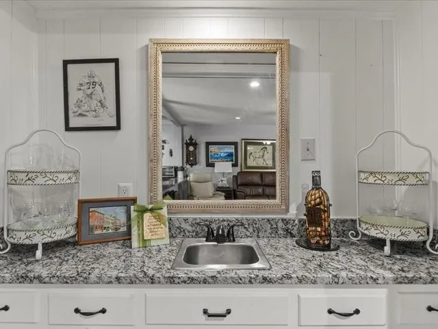 a view of living room with granite countertop and couch