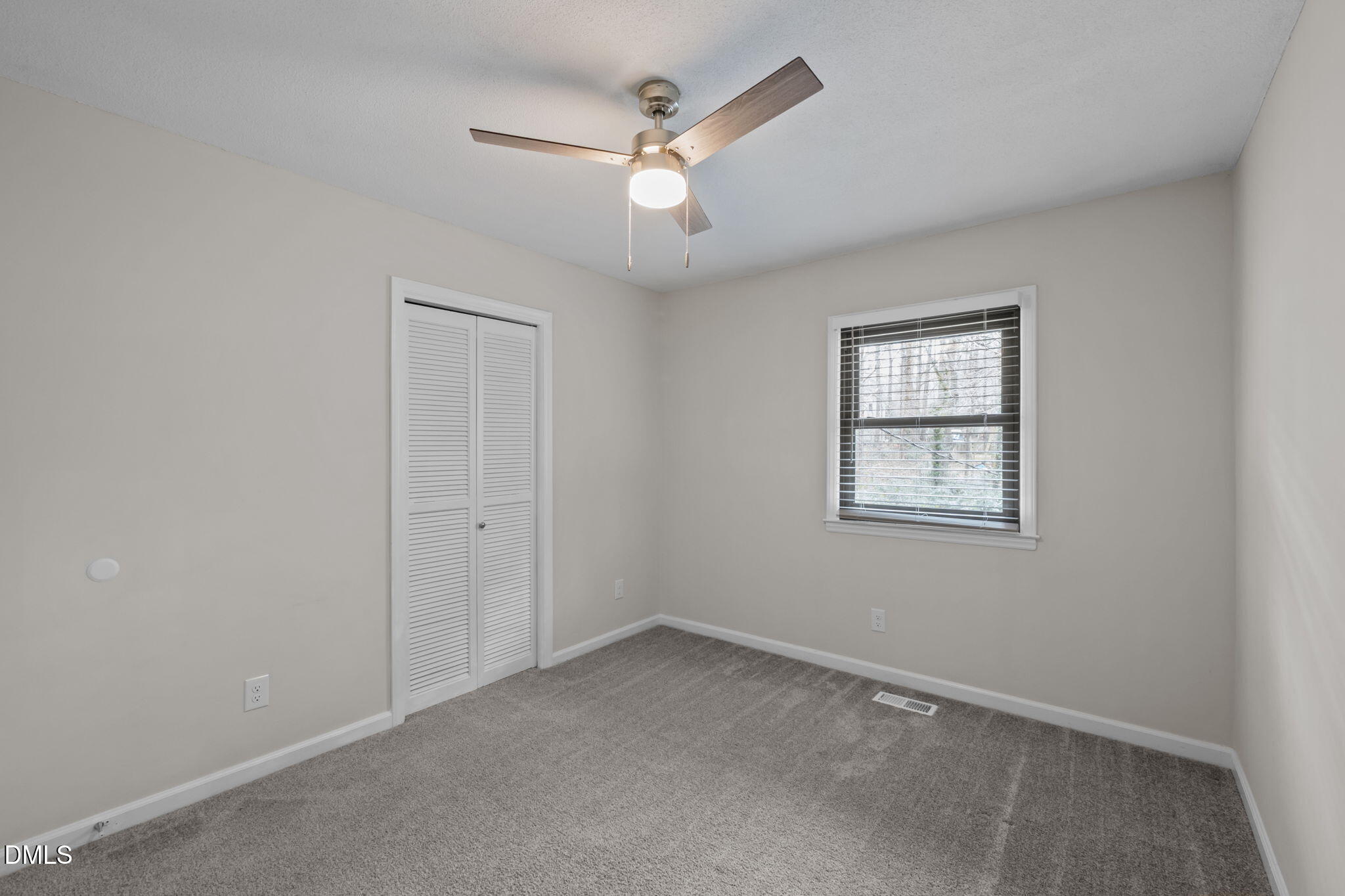 321 Brandywine Road Chapel Hill, NC 27516 - Photo 13 of 38 an empty room with a window and a fan