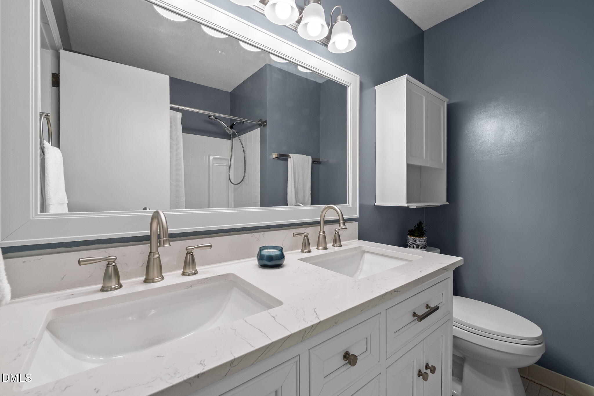 321 Brandywine Road Chapel Hill, NC 27516 - Photo 14 of 38 a bathroom with a sink and a mirror