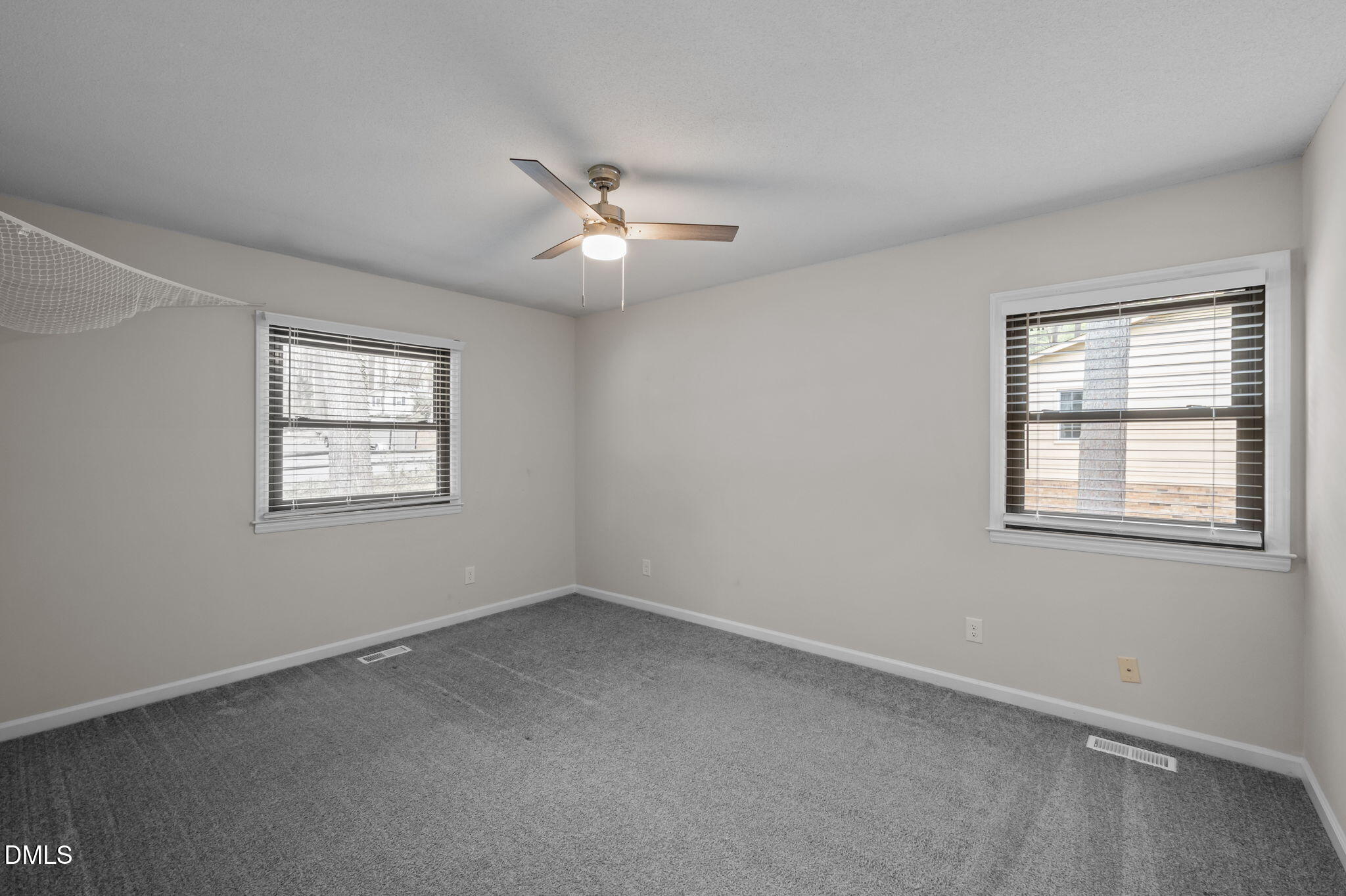 321 Brandywine Road Chapel Hill, NC 27516 - Photo 17 of 38 an empty room with a window and ceiling fan