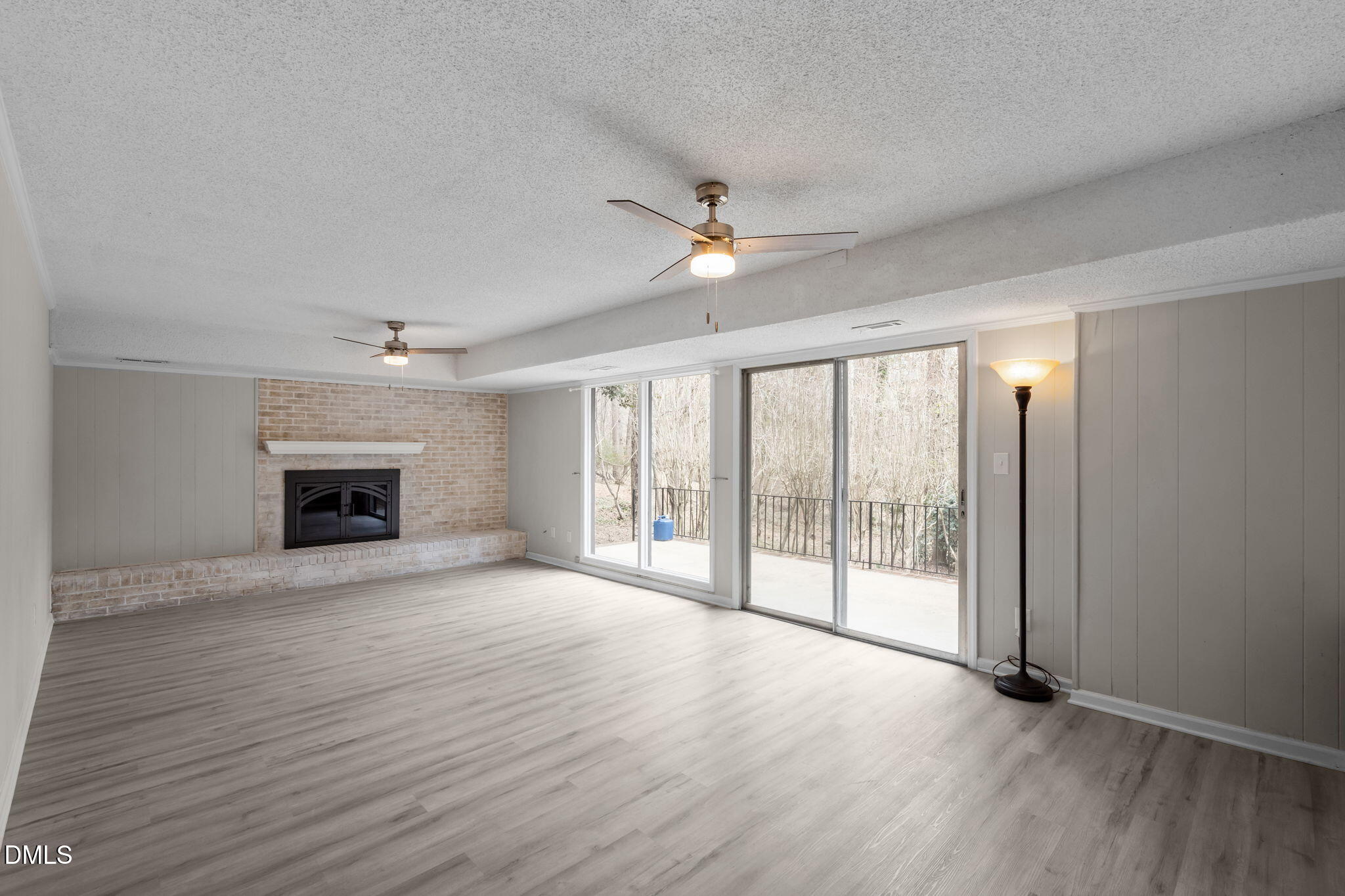 321 Brandywine Road Chapel Hill, NC 27516 - Photo 19 of 38 a view of an empty room with a fireplace and a window