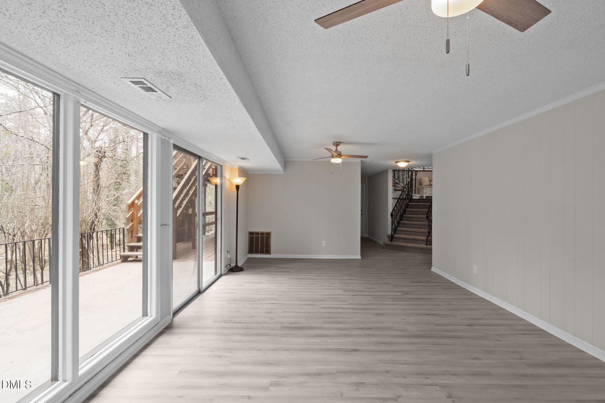 321 Brandywine Road Chapel Hill, NC 27516 - Photo 20 of 38 a view of a hallway with wooden floor and a kitchen