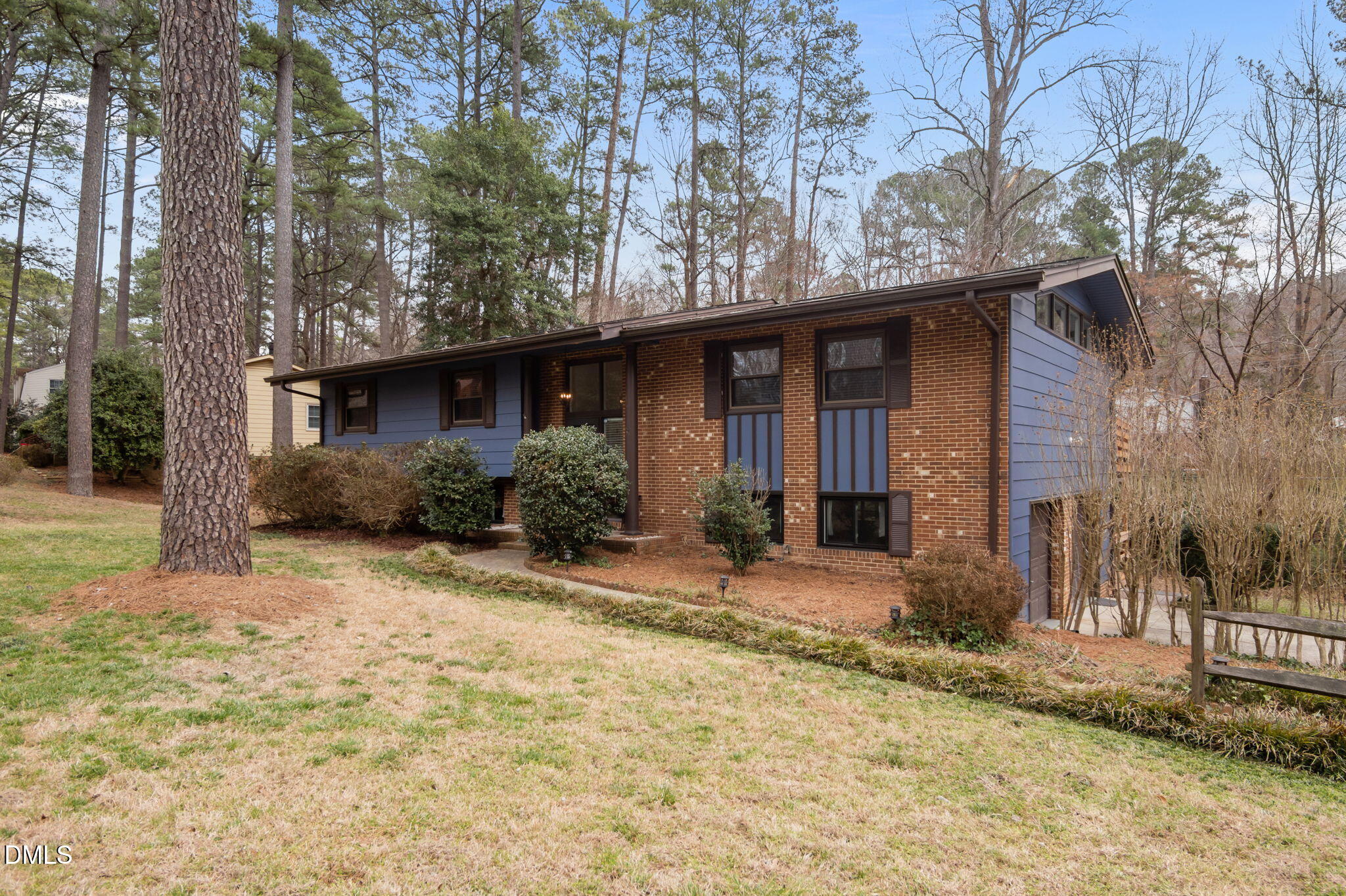 321 Brandywine Road Chapel Hill, NC 27516 - Photo 25 of 38 a front view of a house with a yard and garage