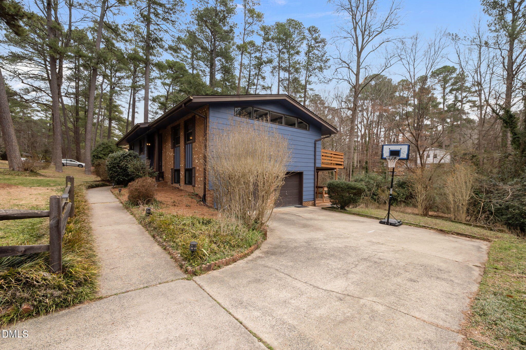 321 Brandywine Road Chapel Hill, NC 27516 - Photo 26 of 38 a pathway of a house with a yard and large trees