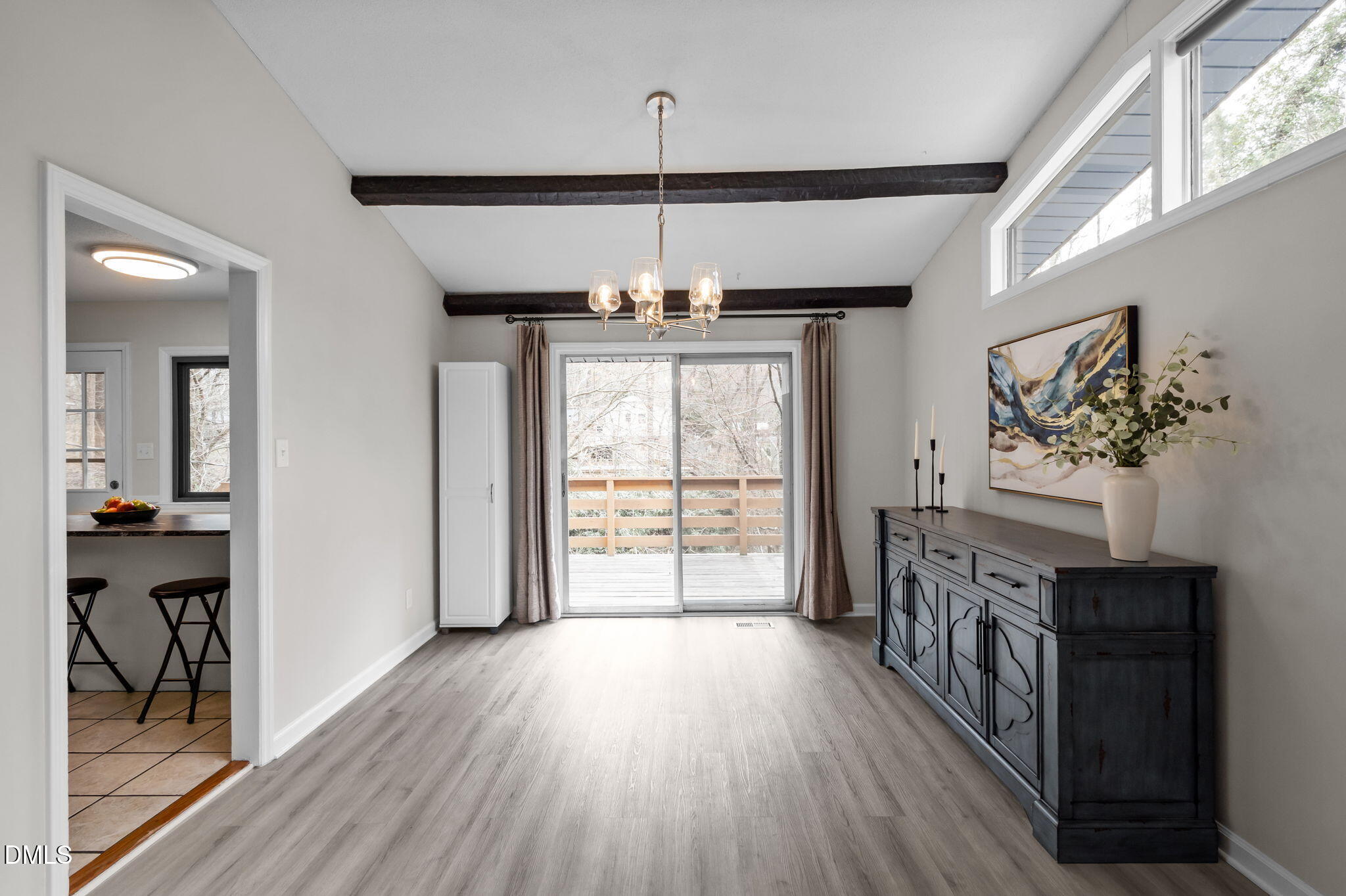 321 Brandywine Road Chapel Hill, NC 27516 - Photo 6 of 38 a view of a hallway with wooden floor and windows
