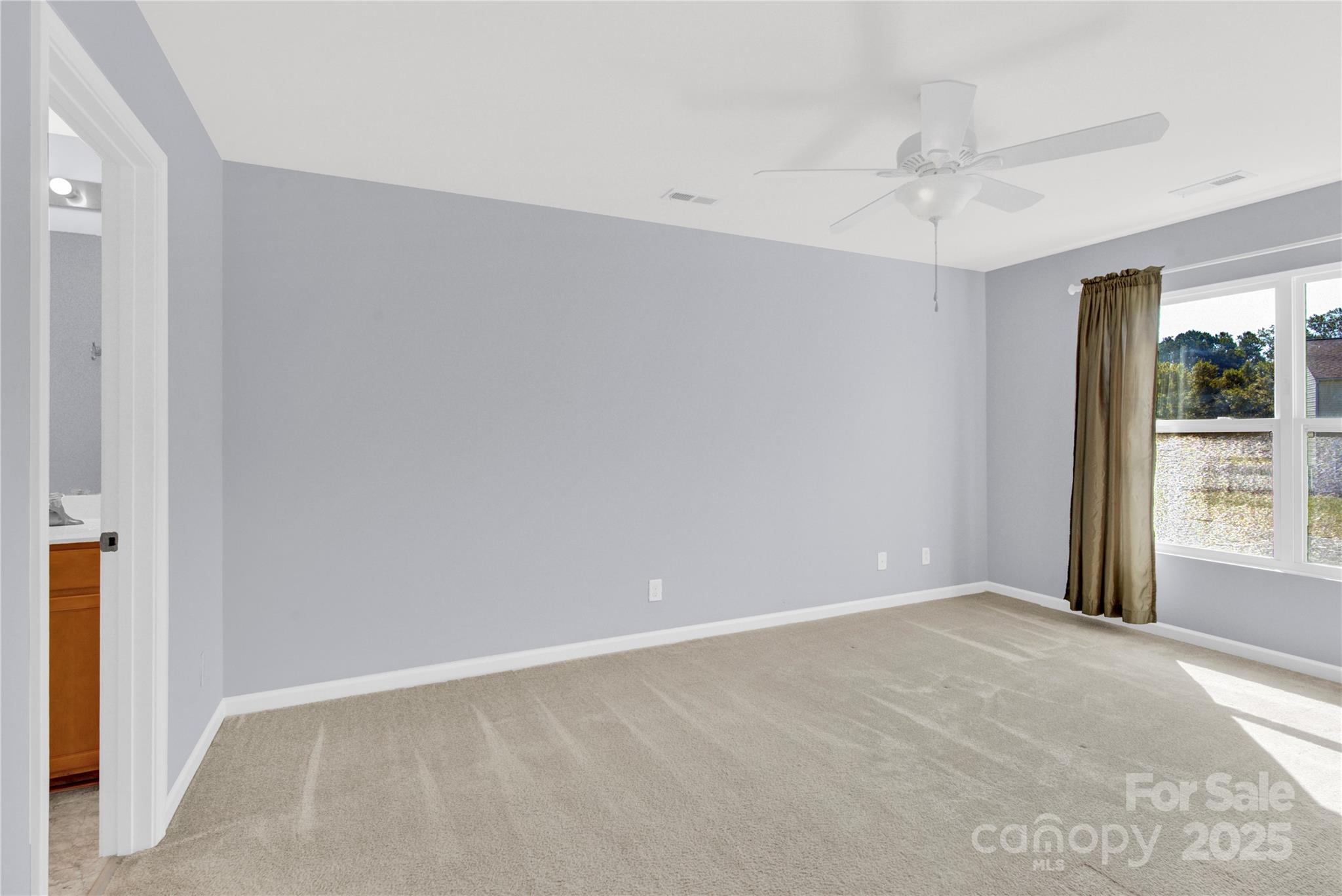 12418 Downy Birch Road Charlotte, NC 28227 - Photo 17 of 37 a view of an empty room with a window