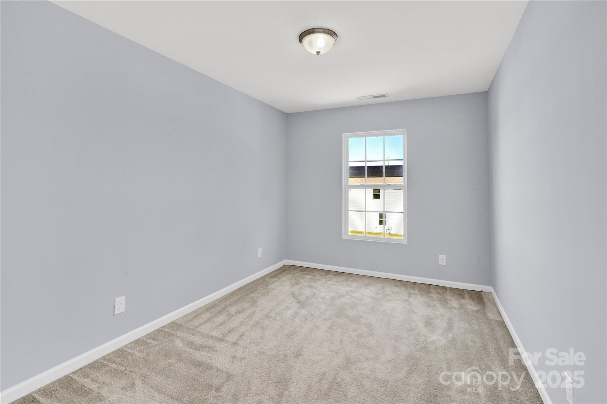 12418 Downy Birch Road Charlotte, NC 28227 - Photo 23 of 37 an empty room with a window