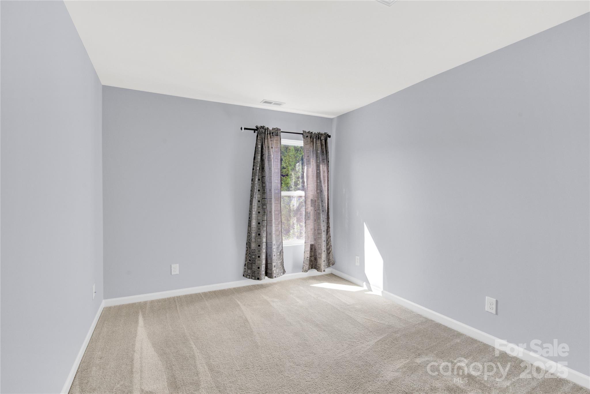 12418 Downy Birch Road Charlotte, NC 28227 - Photo 27 of 37 a view of an empty room with a window