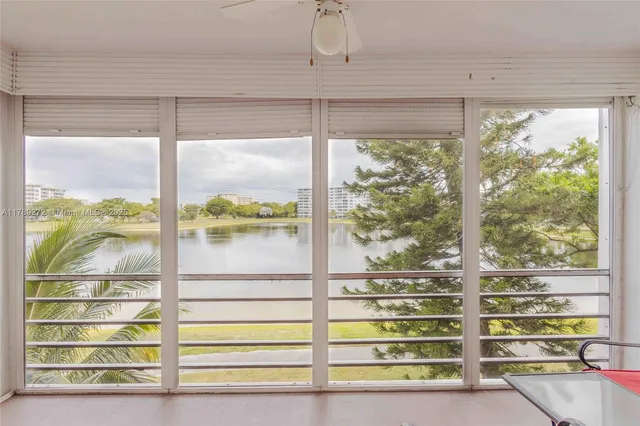 a bedroom with two beds and a window