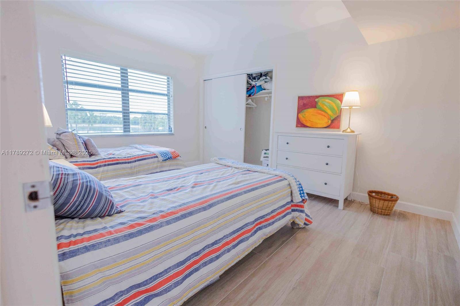 2751 North Palm Aire Drive, Unit 310 Pompano Beach, FL 33069 - Photo 16 of 70 a bedroom with a bed and window