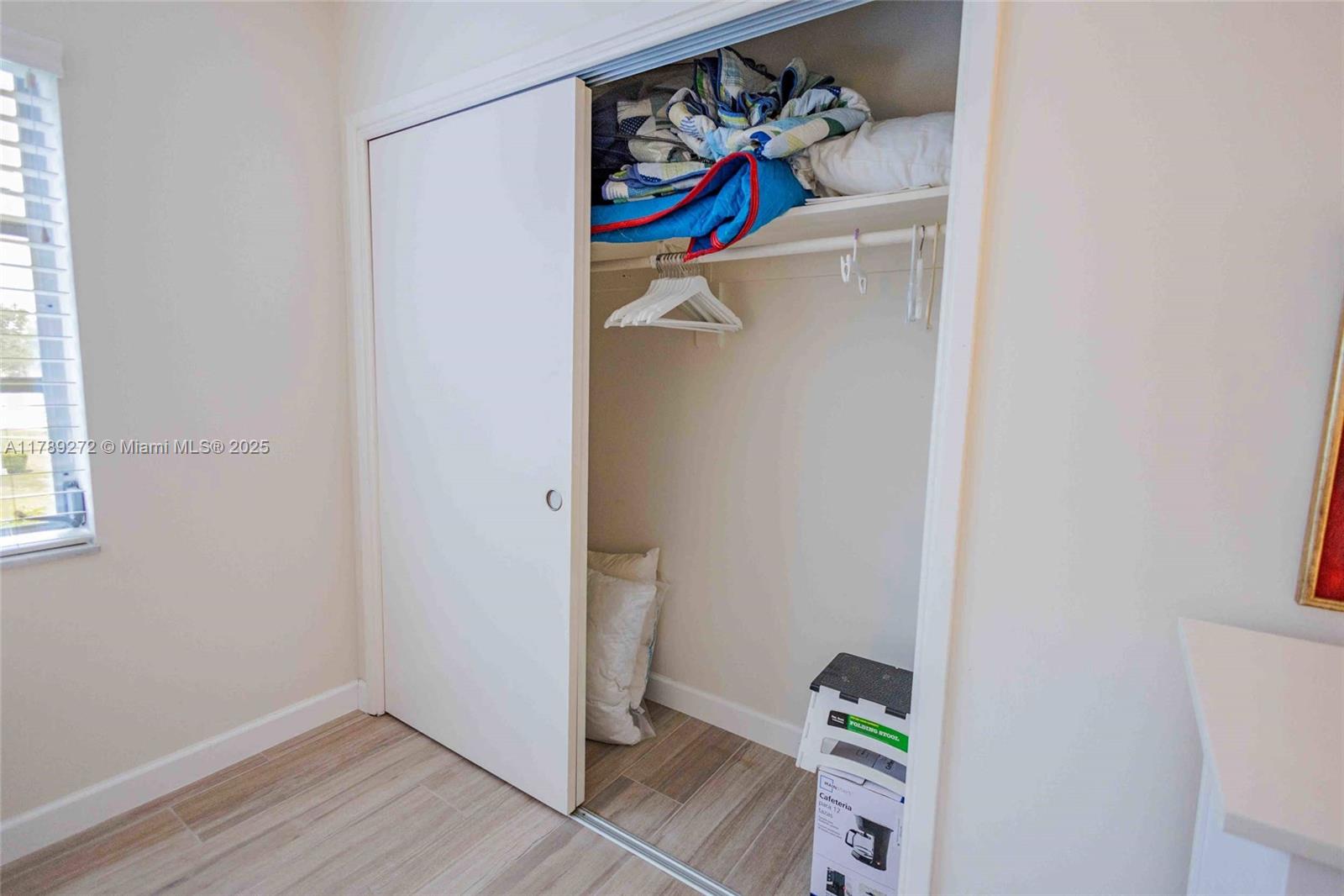 2751 North Palm Aire Drive, Unit 310 Pompano Beach, FL 33069 - Photo 20 of 70 a view of walk in closet with clothes and shoes