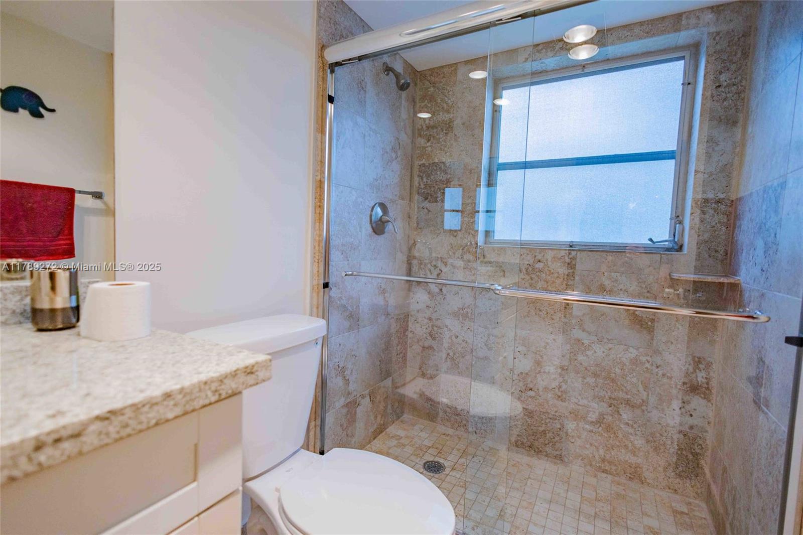 2751 North Palm Aire Drive, Unit 310 Pompano Beach, FL 33069 - Photo 24 of 70 a bathroom with a granite countertop sink toilet and shower