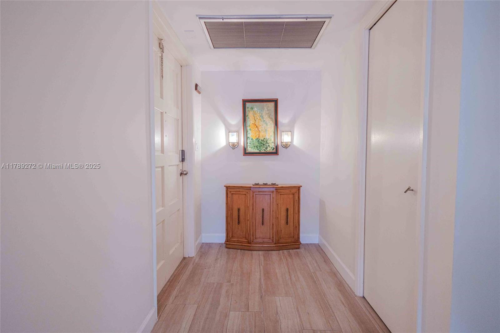 2751 North Palm Aire Drive, Unit 310 Pompano Beach, FL 33069 - Photo 27 of 70 a view of an entryway with wooden floor