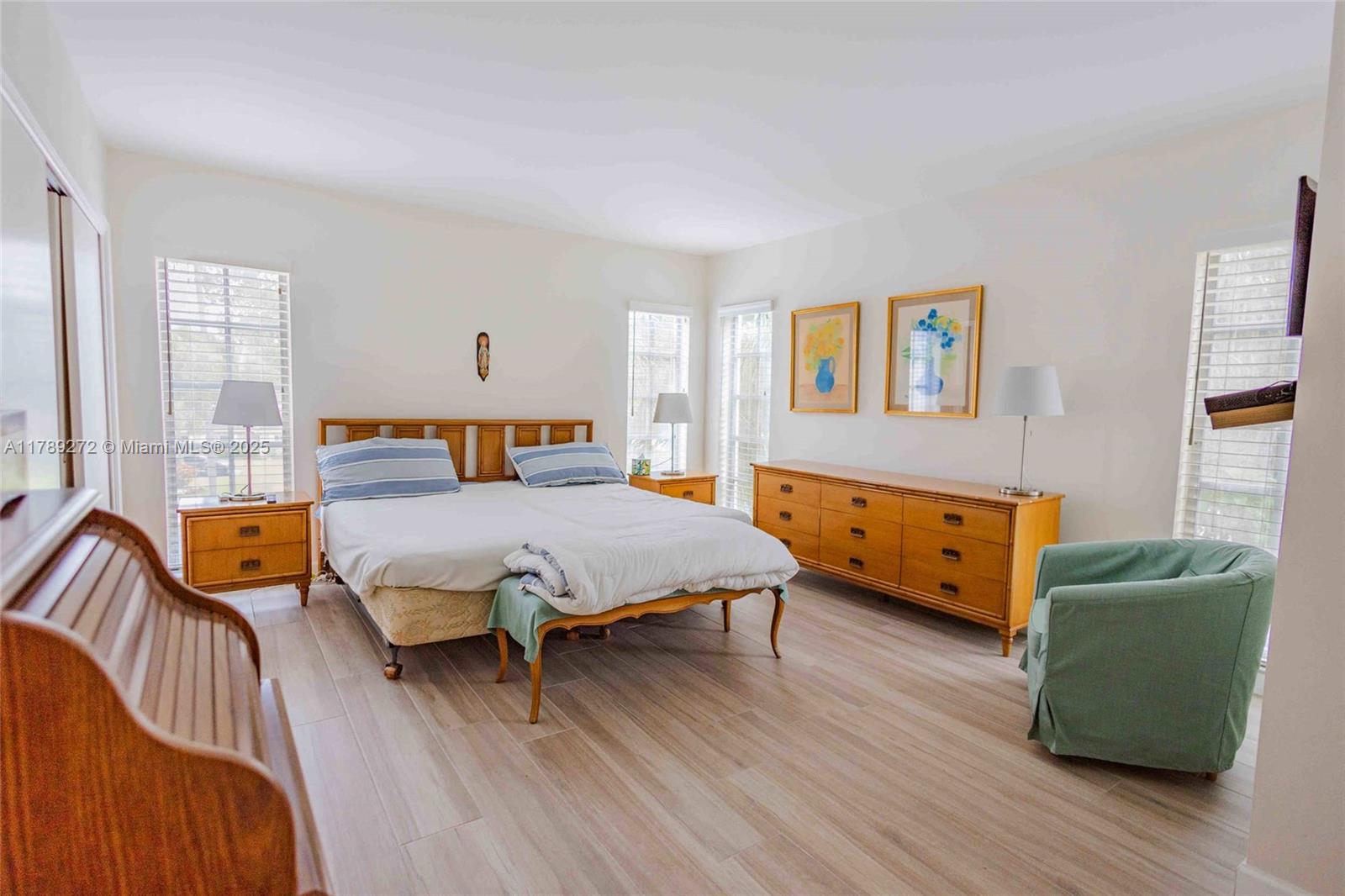 2751 North Palm Aire Drive, Unit 310 Pompano Beach, FL 33069 - Photo 28 of 70 a bedroom with furniture and a window